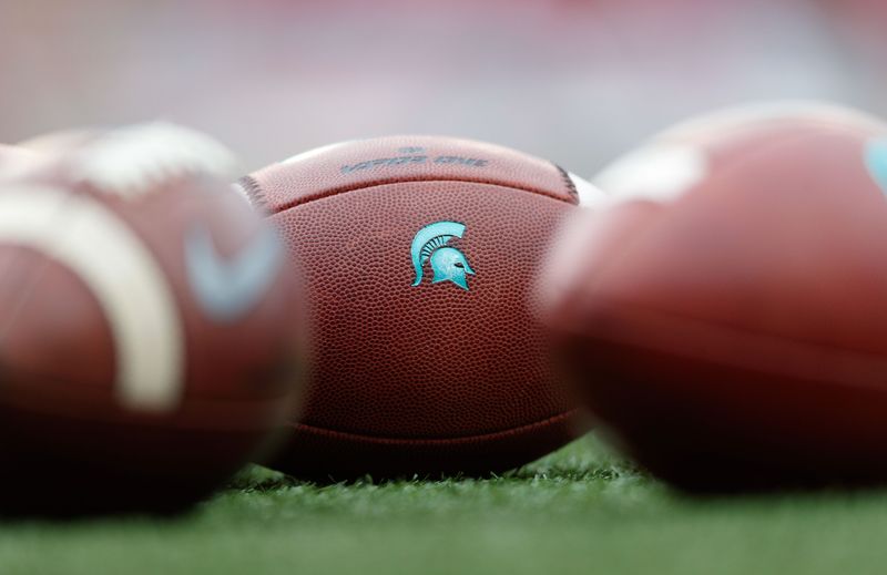 Oct 12, 2019; Madison, WI, USA; Michigan State Spartans logo on footballs during warmups prior to the game against the Wisconsin Badgers at Camp Randall Stadium. Mandatory Credit: Jeff Hanisch-USA TODAY Sports