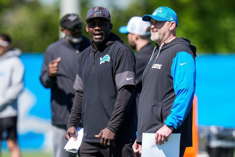 Detroit Lions assistant head coach and wide receivers coach Scottie Montgomery, left, talk to offensive coordinator John Morton during rookie mini camp at Meijer Performance Center in Allen Park on Friday, May 9, 2025.