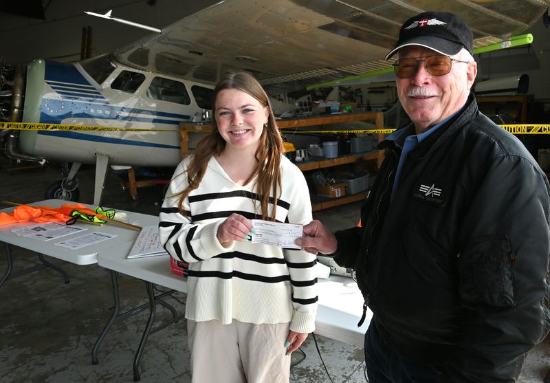 Airport Manager Joe Best presented a $1,500 scholarship to Morgan Dancer from Coldwater. The Western Michigan University aviation student want to become a commercial pilot.