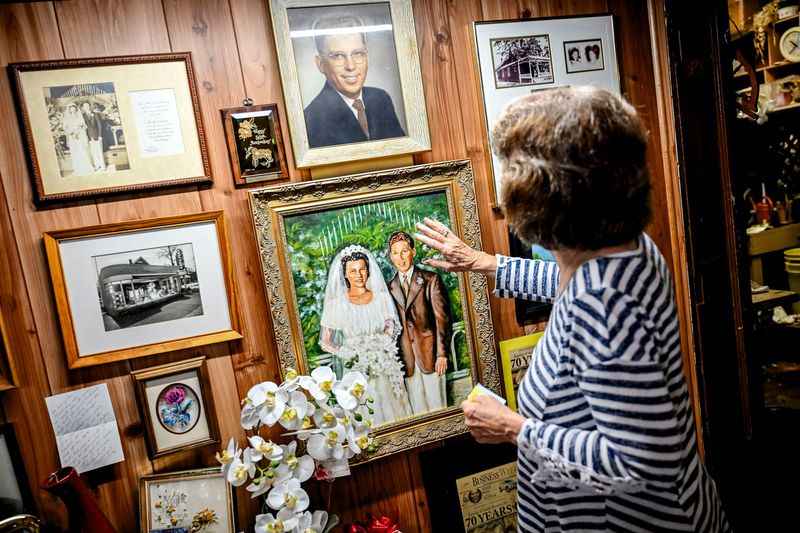 Pamela Sage talks about her parents John and Harriet Anthony while looking at a painting of their wedding picture at Jon Anthony Florist flower and gift shop on Thursday, June 5, 2025, in Lansing.
