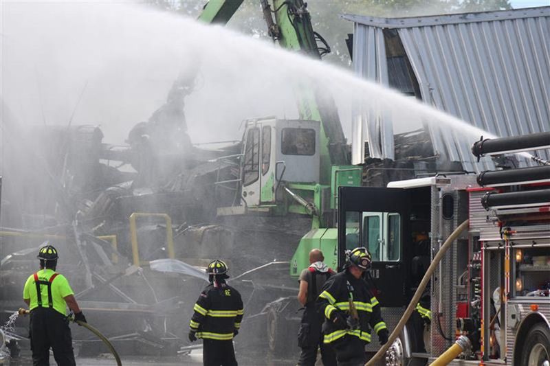 Firefighters battling a warehouse fire near the Tissue Depot paper mill in Cheboygan Sept. 13, 2023.