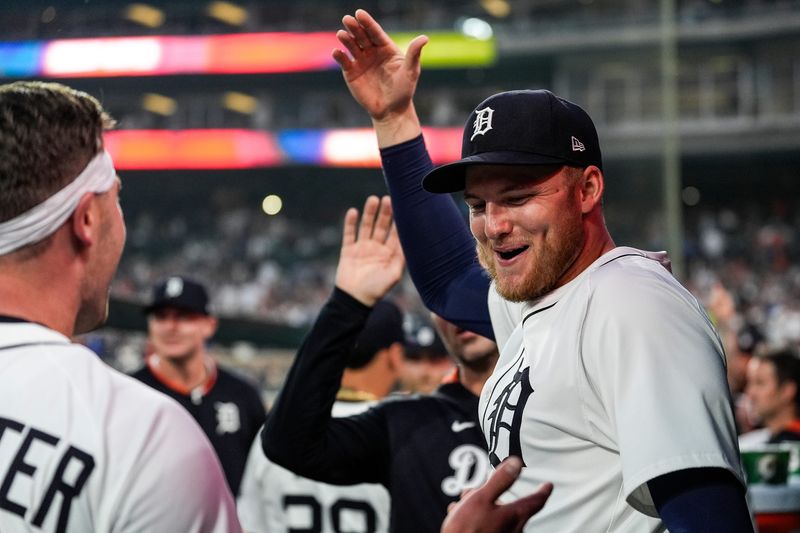 Detroit Tigers center fielder Parker Meadows (22) celebrates a play against Chicago Cubs with right fielder Kerry Carpenter (30), left, during the eighth inning at Comerica Park in Detroit on Friday, June 6, 2025.