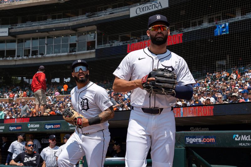 Detroit Tigers second baseman Gleyber Torres, left, (25) takes the field alongside left fielder Riley Greene (31) during their game against the Chicago Cubs at Comerica Park in Detroit on Saturday, June 7, 2025.