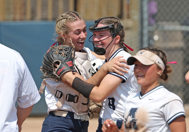 Peyton Zajac (left) and Brenna Baker of Airport celebrate a 2-0 win over Tecumseh in the semifinals of the Division 2 Regional at Chelsea on Saturday, June 7, 2025.
