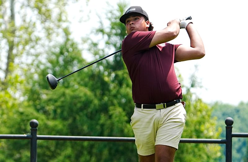 Ian Masih of Okemos High School tees of on the 17th green during the 2025 MHSAA LP Division 1 Boys Golf Finals at Forest Akers West at Michigan State University in East Lansing on Saturday, June 7, 2025.
Masih won the individual championship with Jack Whitmore of Detroit Catholic Central coming in second.