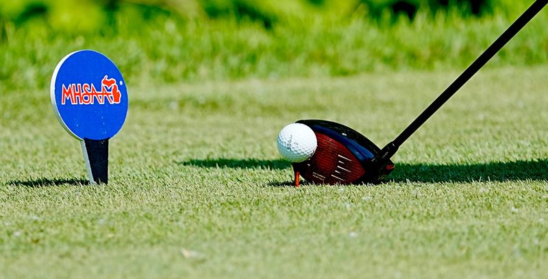 A golfer tees off on the 7th tee during the 2025 MHSAA LP Division 1 Boys Golf Finals at Forest Akers West at Michigan State University in East Lansing on Saturday, June 7, 2025.