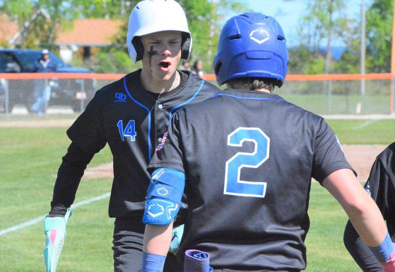 Inland Lakes' Harper Lee (left) and Ty Kolly (2) celebrate during a district baseball semifinal against Rogers City on Saturday, May 31. Both players return for the Bulldogs in 2026.