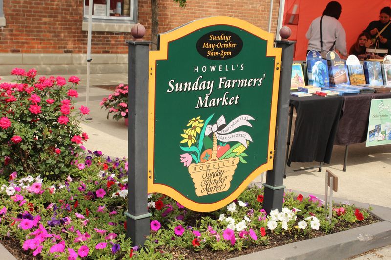 A sign welcomes shoppers to the Howell Sunday Farmers Market.
