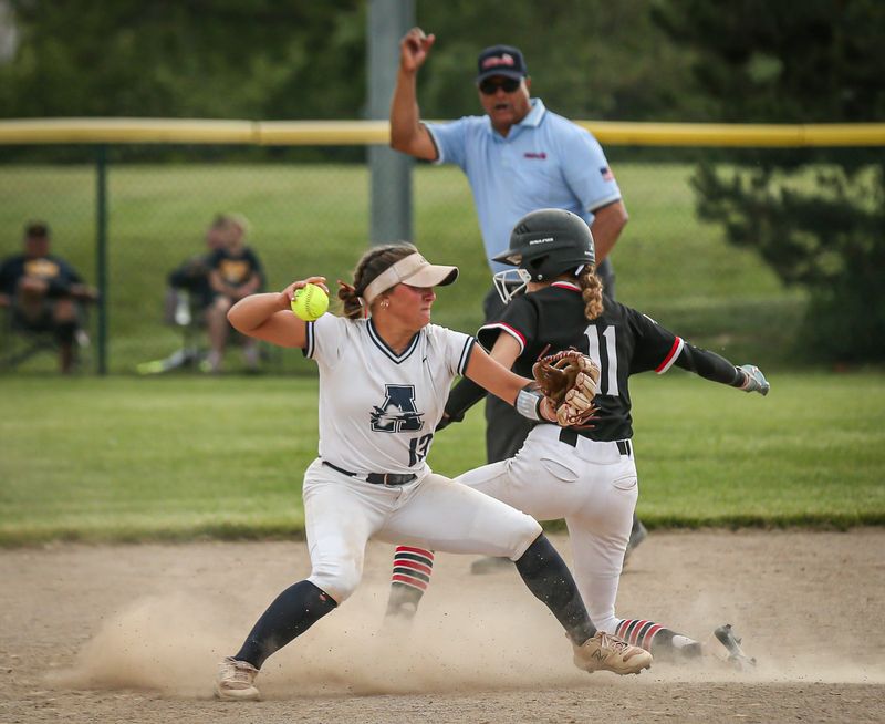 Airport's Olivia Tilley gets the out at second on Katherine Modrzejewski of Dearborn Divine Child in sixth inning action of a 5-2 Airport victory over Dearborn Divine Child in the Division 2 state quarterfinals on Tuesday, June 10, 2025.