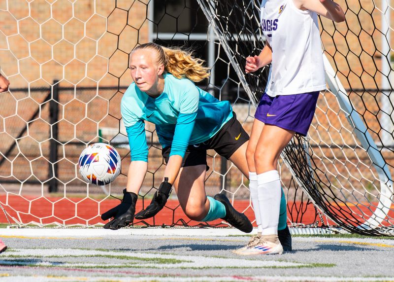 Plymouth Christian Academy's Mary Michalak makes a save during the Division 4 girls soccer state semifinal on Wednesday, June 11, 2025, at Waterford Kettering's Jim Larkin Stadium.