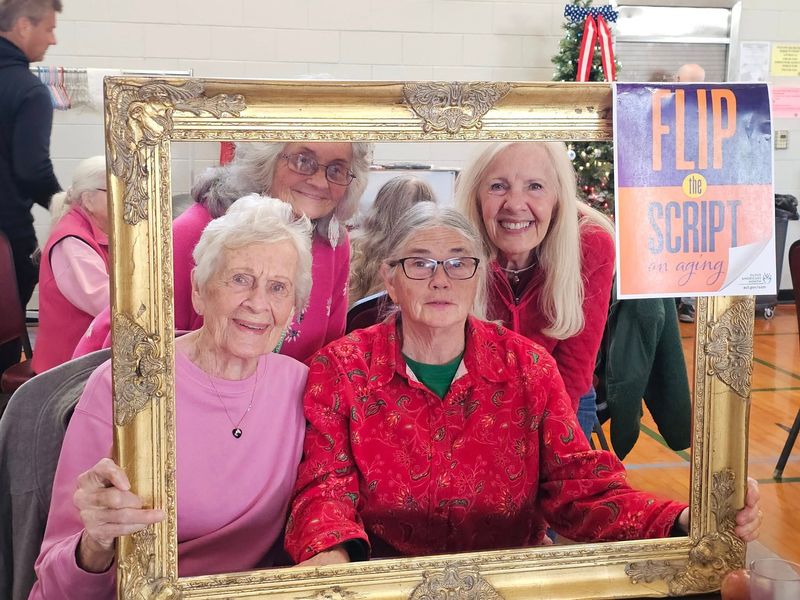 Seniors gather for a photo at the newly reopened Charlevoix Senior Center, where social connection is front and center. With expanded space and activities, the center offers a setting to combat isolation and celebrate aging in community.