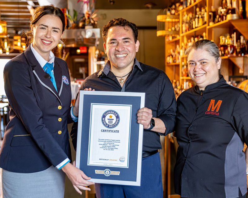 Chole McCarthy (left) Junior Merino (center) and Heidi Merino with Guinness World Records certification at M Cantina