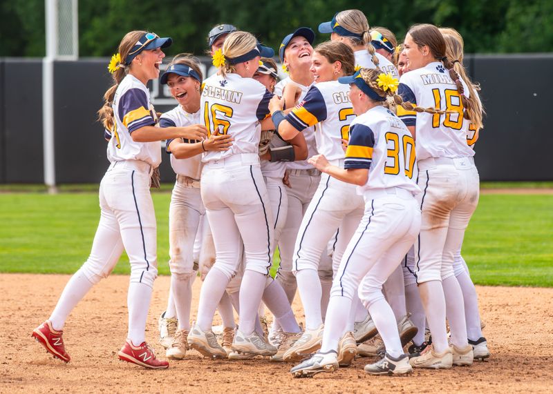 South Lyon celebrates winning the Division 1 softball state semifinal on Thursday, June 12, 2025, at Michigan State's Secchia Stadium.