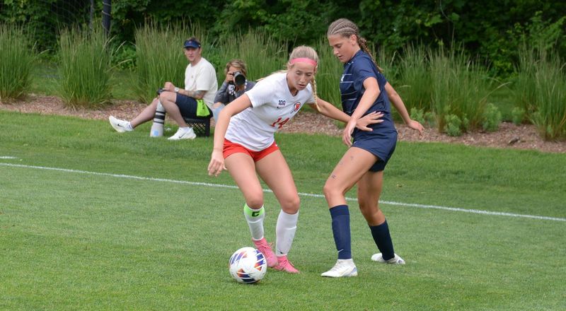New Boston Huron's Addison Dolencic (left) battles Olivia Walters of Hudsonville Unity Christian in the Division 2 state finals on Fridauy, June 13, 2025.