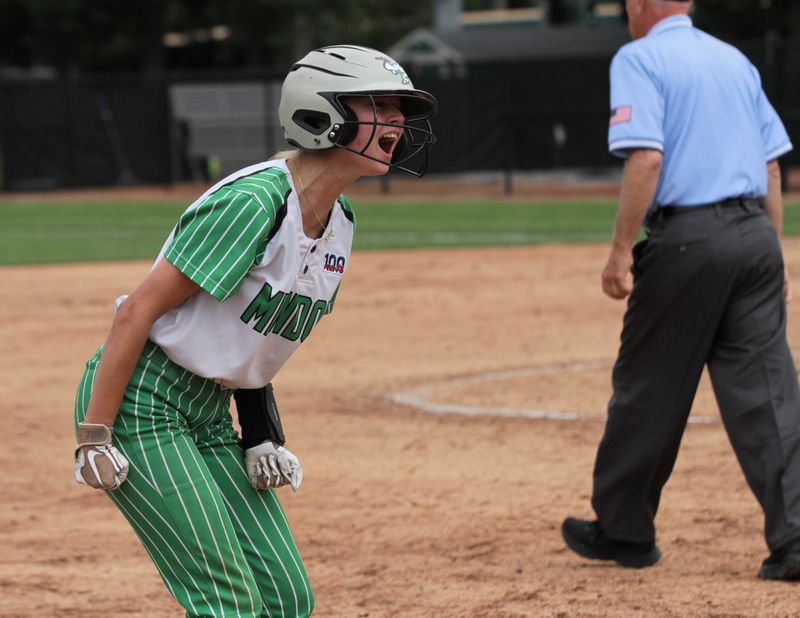 Jadyn Samson yells back at the dugout after reaching third base on a triple Friday.