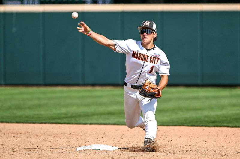 Marine City's Paul Muscat turns a double play against Traverse City St. Francis during the fifth inning on Saturday, June 14, 2025, in the Division 3 baseball state final at McLane Stadium in East Lansing.