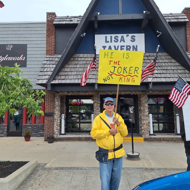 Ron Martus of Johannesburg holds a sign during the "No Kings" protest in Gaylord on Saturday, June 14, 2025.
