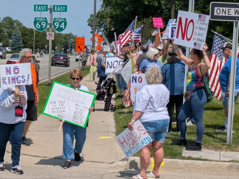 Hundreds of people gather along Pine Grove Avenue Saturday, June 14, in Port Huron during the No Kings protest.