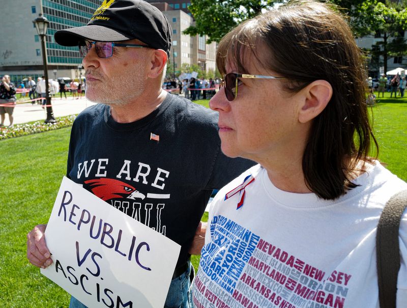 Retired teachers Steve and Susan Swaton, from Marshall, attended the "No Kings" rally at the Michigan Capitol Saturday, June 14, 2025, because they are concerned about the direction education is headed under President Donald Trump's administration.