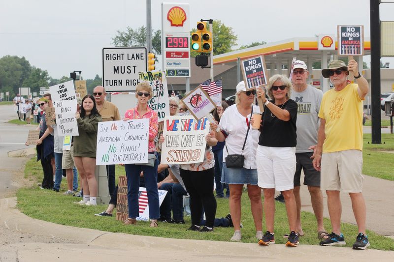 More than 350 gathered Saturday along U.S. 131 in Three Rivers as part of the national No Kings movement, protesting the policies and administration of President Donald Trump. The event, organized locally by River Country Solidarity, had few disruptions by passersby.