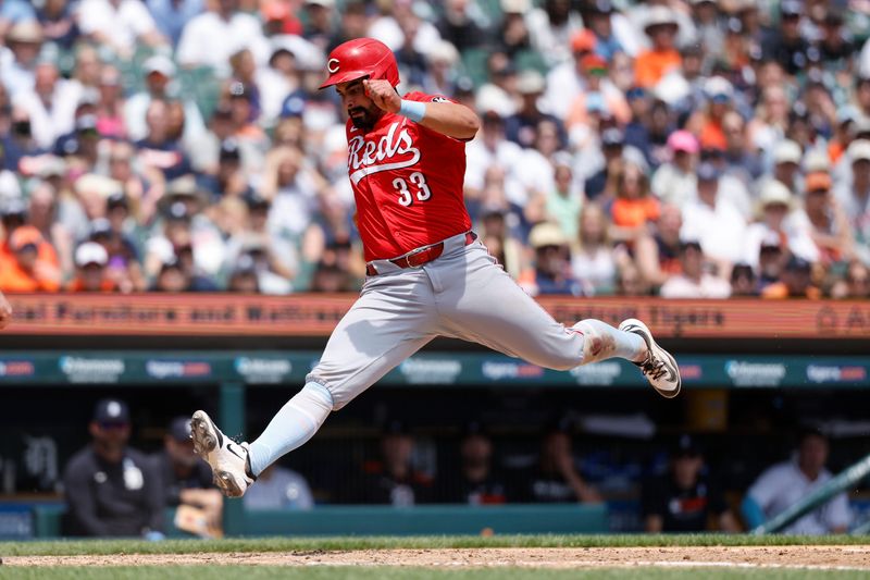 Jun 15, 2025; Detroit, Michigan, USA; Cincinnati Reds first baseman Christian Encarnacion-Strand (33) scores on a wild pitch in the eighth inning against the Detroit Tigers at Comerica Park. Mandatory Credit: Rick Osentoski-Imagn Images