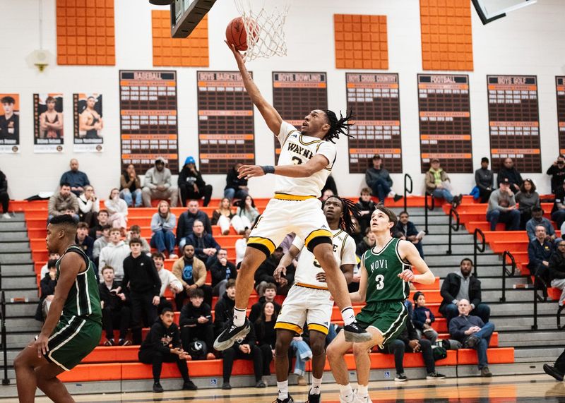 Wayne Memorial's Carlos Medlock Jr. scores during the Kensington Lakes Activities Association boys basketball championship on Friday, Feb. 21, 2025, at Northville High School.