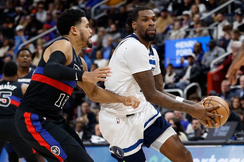 Minnesota Timberwolves center Naz Reid dribbles defended by Detroit Pistons forward Tobias Harris in the second half at Little Caesars Arena, Jan. 4, 2025 in Detroit.