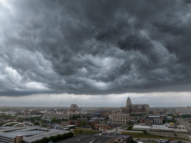 Storm clouds move over the Fisher Building and the rest of New Center in Detroit, June 18, 2025.