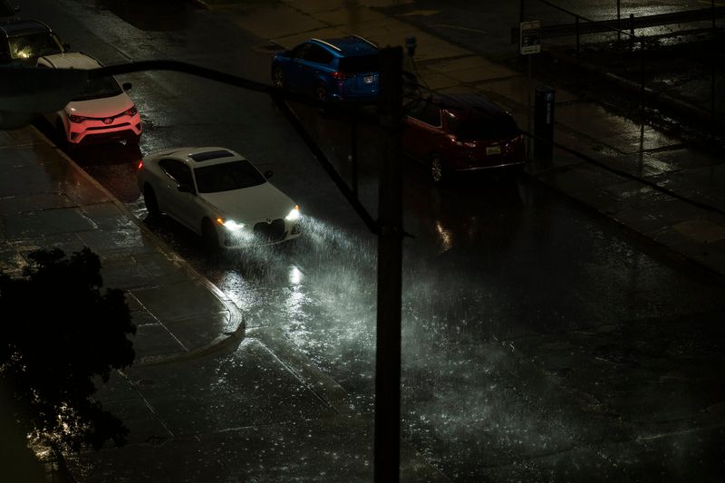 Heavy rain falls as a large thunderstorm moves east over Detroit on Wednesday, June 18, 2025.