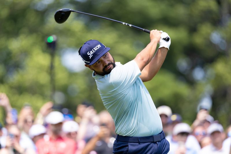 J.J. Spaun plays his shot from the first tee during the first round of the Travelers Championship golf tournament.