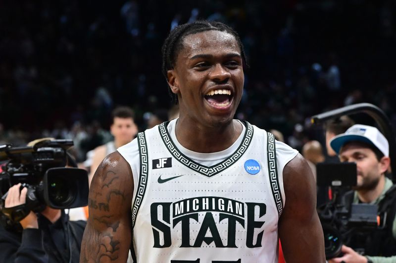 Mar 23, 2025; Cleveland, OH, USA; Michigan State Spartans forward Coen Carr (55) celebrates after the game against the New Mexico Lobos during the NCAA Tournament Second Round at Rocket Arena. Mandatory Credit: Ken Blaze-Imagn Images