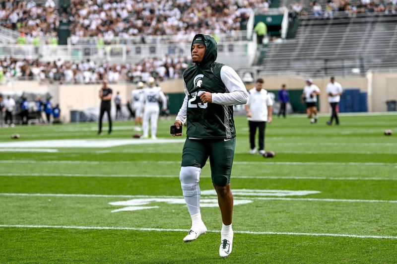Michigan State linebacker Darius Snow warms up before the game against Washington on Saturday, Sept. 16, 2023, at Spartan Stadium in East Lansing.