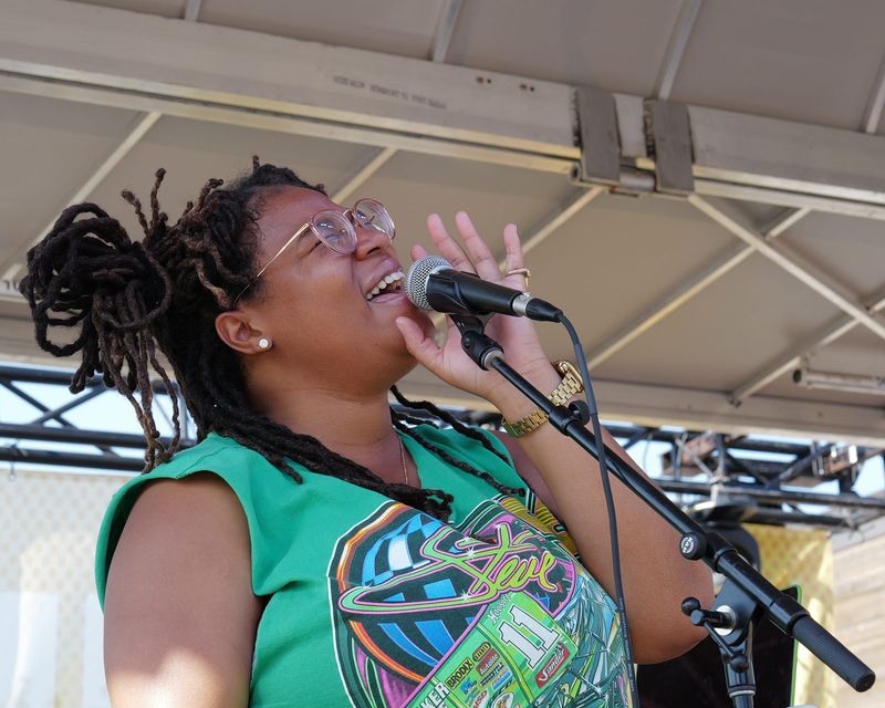 Singer, songwriter, and DJ, Jess Ivers from Kalamazoo, performs at the 517 Juneteenth Festival in Lansing's REO Town Saturday, June 21, 2025.