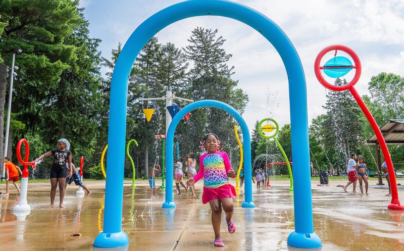A’myia Surgeon, 5, of Detroit plays among plays at the Splash Pad in Palmer Park in Detroit on Saturday, June 21, 2025.