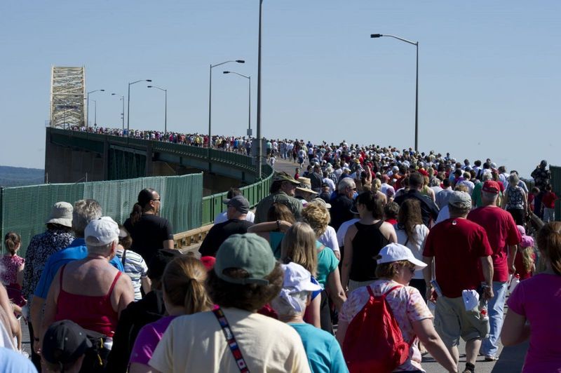 People walk across the International Bridge in Sault Ste. Marie, Michigan, in 2023.