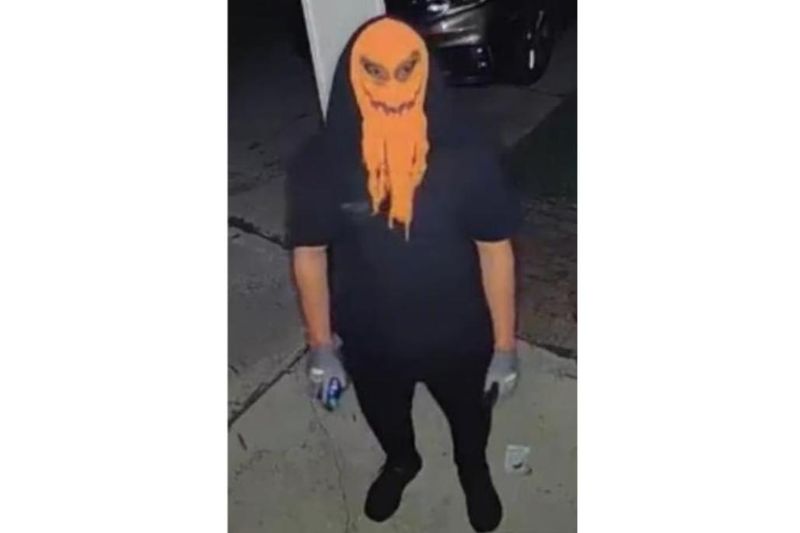 A person in an orange mask is seen in Dearborn Heights, allegedly targeting a family. Police are asking for help identifying the individual.