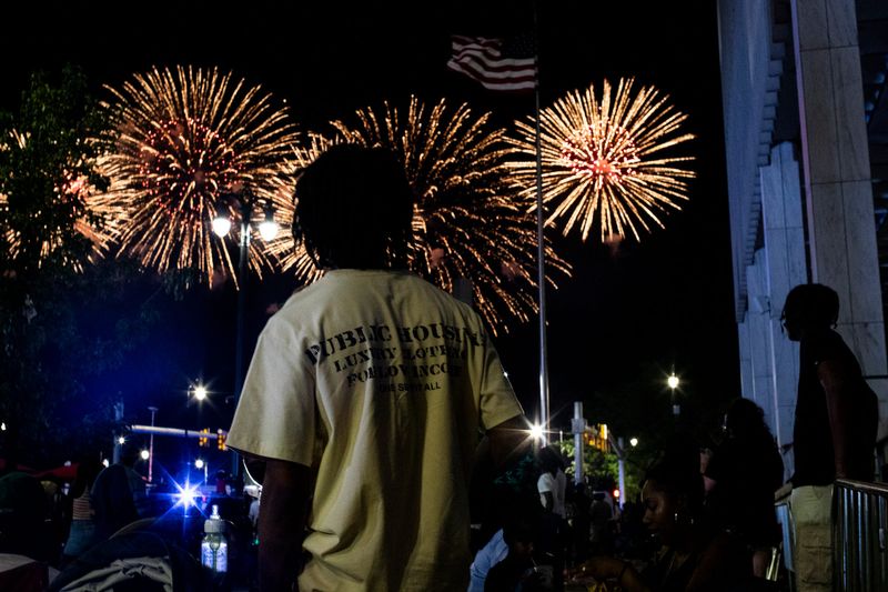Families and friends gather to watch the Ford Fireworks in Spirit Plaza on June 23, 2025 in downtown Detroit.