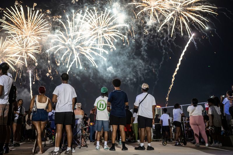 People watch the 2025 Ford Fireworks at Hart Plaza in downtown Detroit on Monday, June 23, 2025.