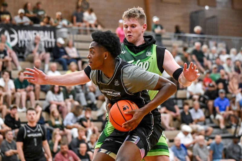 Michigan State's Jaxon Kohler, right, guards Team Motorcars and Michigan State's Cam Ward during the Moneyball Pro-Am on Tuesday, June 24, 2025, at Holt High School.