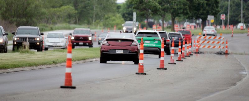 Vehicles navigate along construction cones on Memorial Drive and state Highway 42 along Lake Michigan, Wednesday, June 25, 2025, in Manitowoc, Wis.