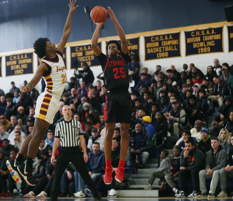 Stepinac's Jasiah Jervis (25) puts up a shot in front of Cardinal Hayes' Trevon Lewis (21) during the CHSAA Class AA basketball championship at Mount Saint Michael Academy in the Bronx Feb. 25, 2023. Cardinal Hayes won the game 85-69.

Stepinac Vs Hayes Chsaa Basketball Championship