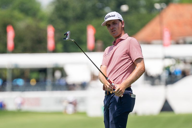 Ryan Gerard chips onto the 10th green during the third round of the Rocket Classic.