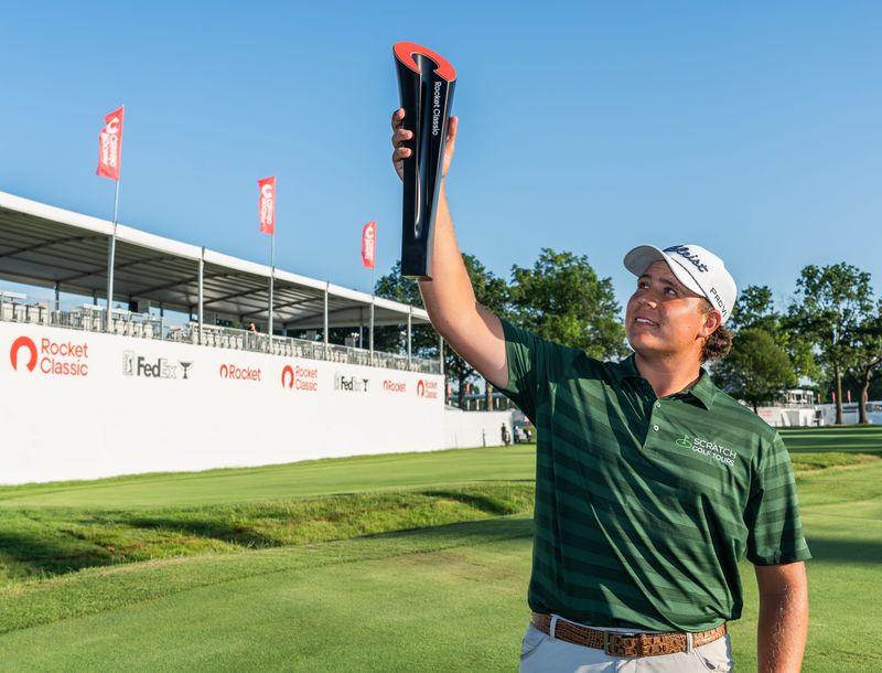 Aldrich Potgieter stands for photos with the championship trophy after winning in the fifth overtime during the final round of the Rocket Classic at the Detroit Golf Club in Detroit on Sunday, June 29, 2025. This is his first PGA tour title.