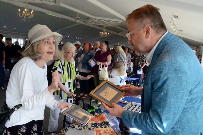 Appraiser Stanley Bystrowski (right) helps Maxine sort her items for a later, more in-depth appraisal on Tuesday, July 1, 2025 as the popular PBS TV series "Antiques Roadshow" made a stop in Charlevoix to film three episodes. Per "Antiques Roadshow" media guidelines, only the first names of guests may be published.