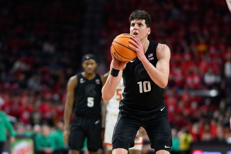 Feb 26, 2025; College Park, Maryland, USA; Michigan State Spartans center Szymon Zapala (10) shoots a free throw during the first half against the Maryland Terrapins at Xfinity Center. Mandatory Credit: Reggie Hildred-Imagn Images