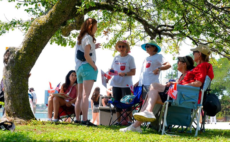 State Sen. Mallory McMorrow listens to protesters talk about the issues during the Indivisible We The People Dissent rally and protest at Hart Plaza in Detroit on Saturday, July 5, 2025.
