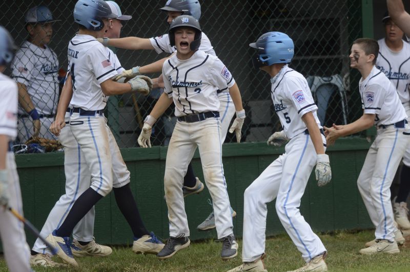 Richmond players celebrate after Jake Jozwiak scored the game-trying run against Taylor North during the Michigan Little League baseball intermediate state championship in Richmond on Monday, July 7, 2025.