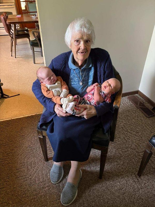 Ruth Masserant holds her recently born 199th and 200th descendants, Griffin James Jones (left) and Rosalie Mae Skinner, who were born two days apart.