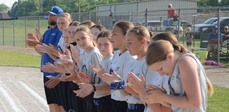 Ida lines up for player introductions before a 15-0 Ida victory over Frenchtown in the 51st annual Monroe County Fair Softball Tournament on Tuesday, July 8, 2025.