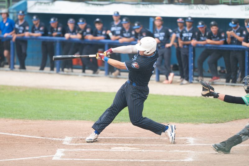 Battle Jacks infielder Nathan Ball takes a swing during a game against Royal Oak at C.O. Brown Stadium in action earlier this season.
